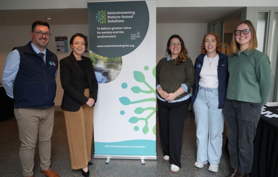Team photo stood in front of MNbS banner at NI stakeholder event